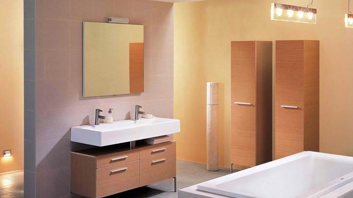 White Bathtub And Wooden Drawer In Bathroom